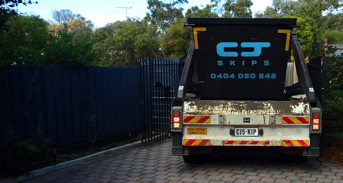 CJ Skips truck delivering skip bins